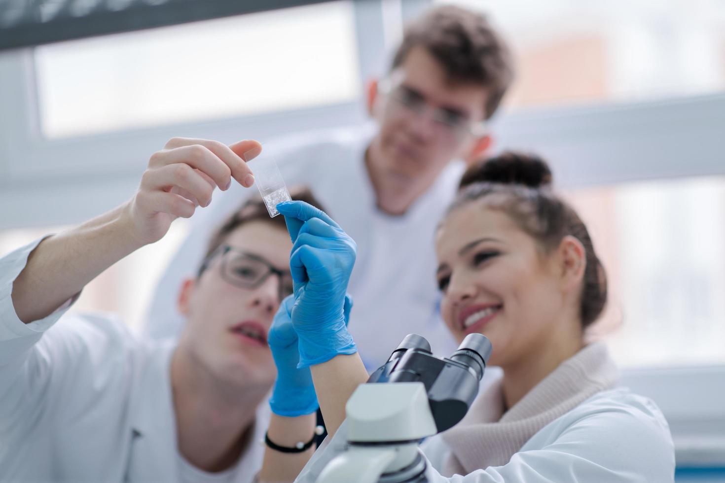 Group of young medical students doing research photo