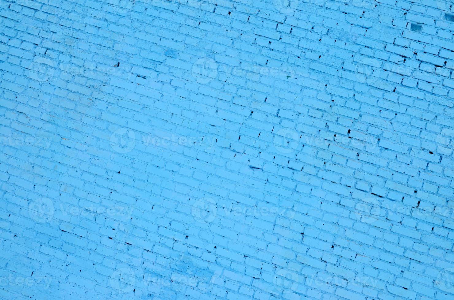 Square brick block wall background and texture. Painted in blue photo