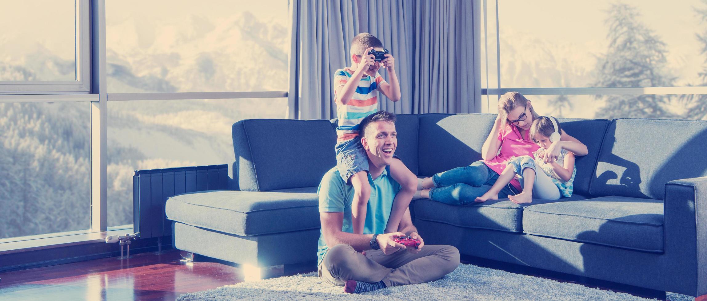 Happy family playing a video game photo