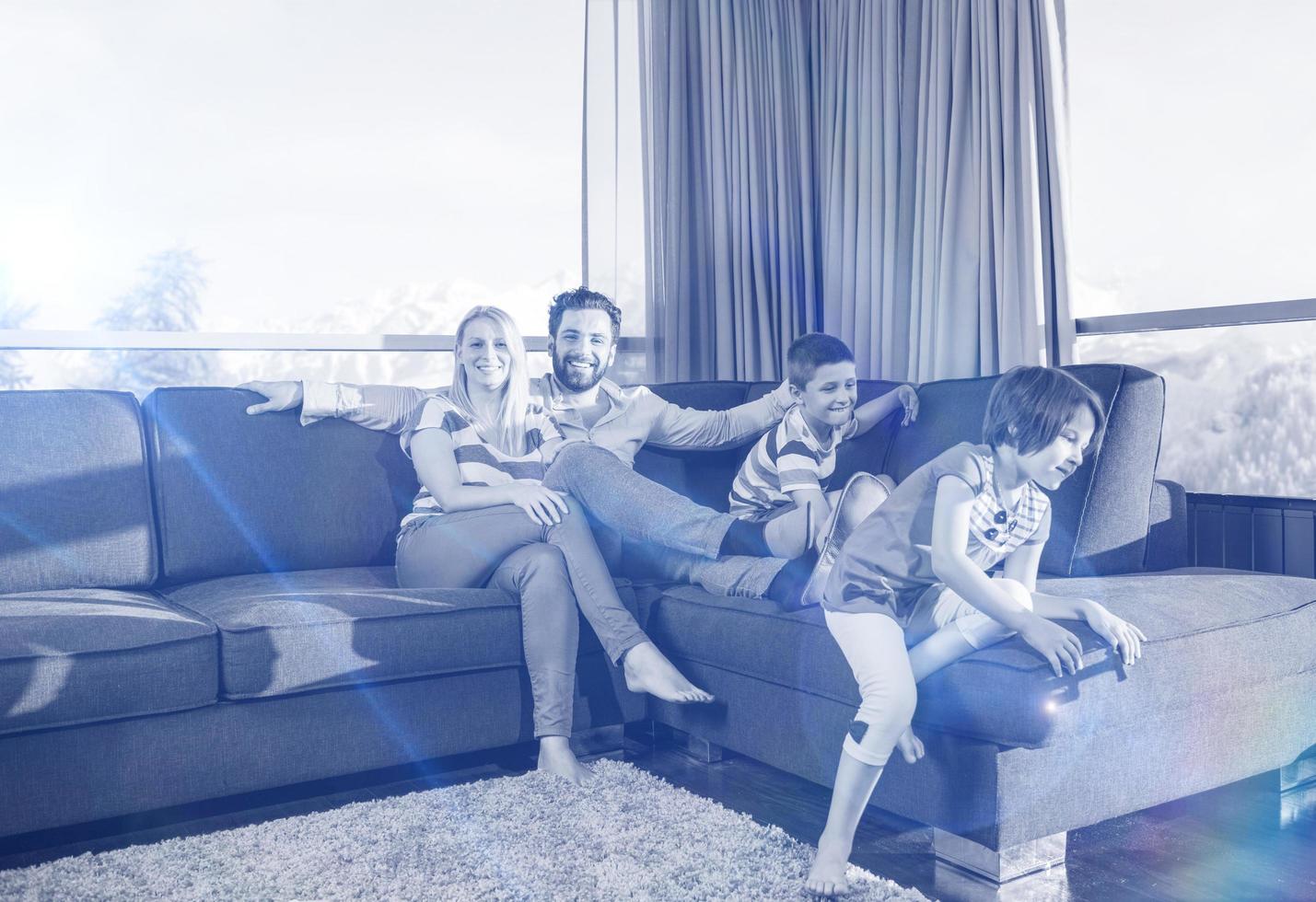 Happy Young Couple Spending Time With Kids At Home 12755540 Stock Photo happy-young-couple-spending-time-with-kids-at-home-12755540-stock-photo