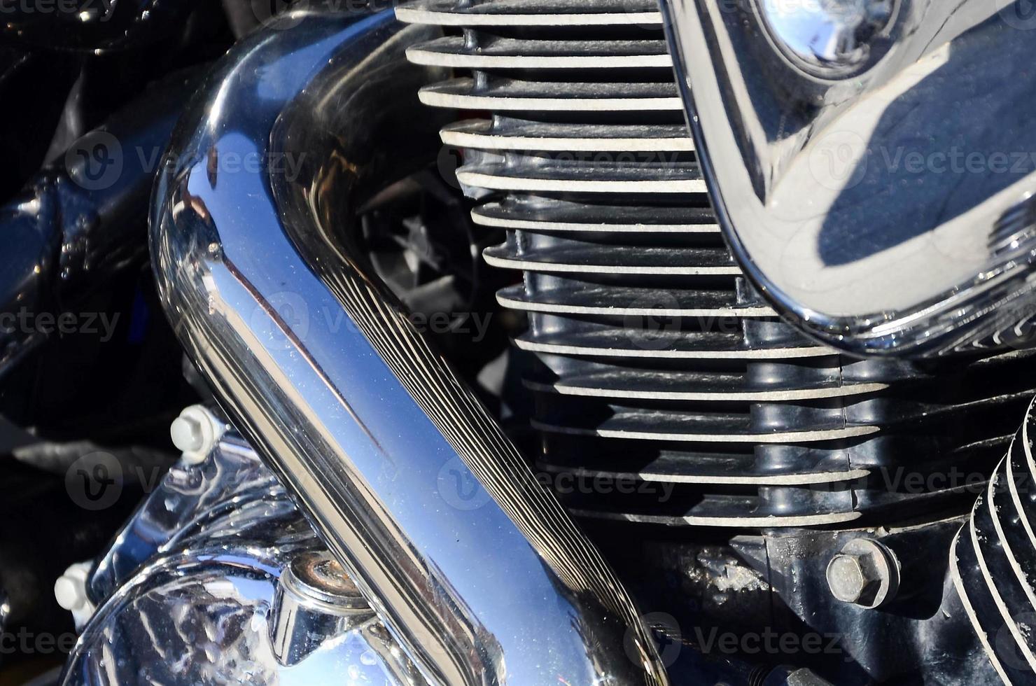 Fragment of chromed shiny body part of old classic motorbike photo