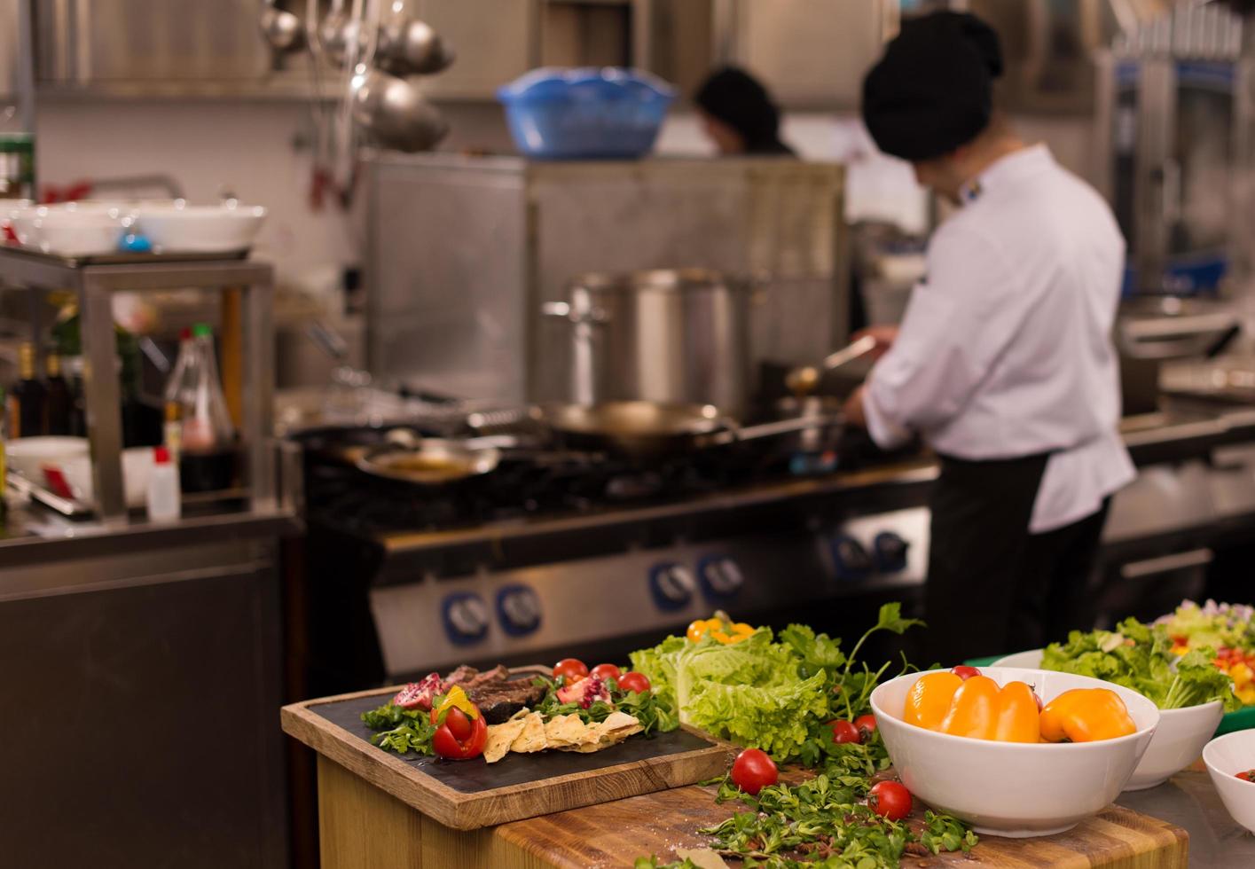 team cooks and chefs preparing meal photo