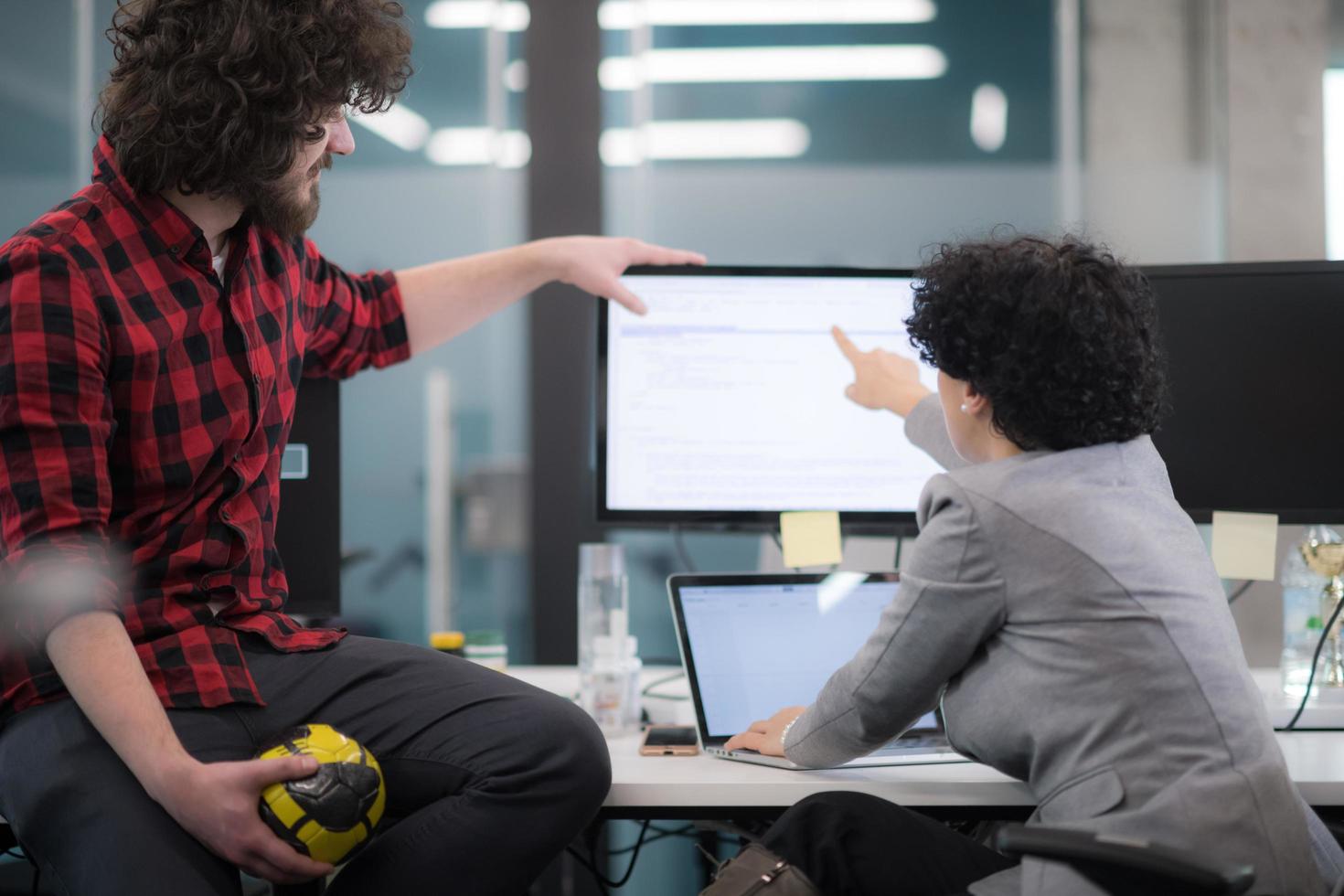 software developers couple writing programming code photo