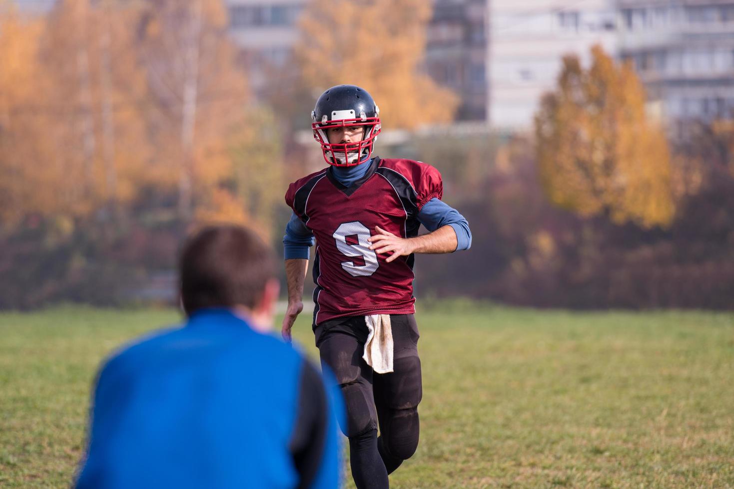 american football team with coach in action photo