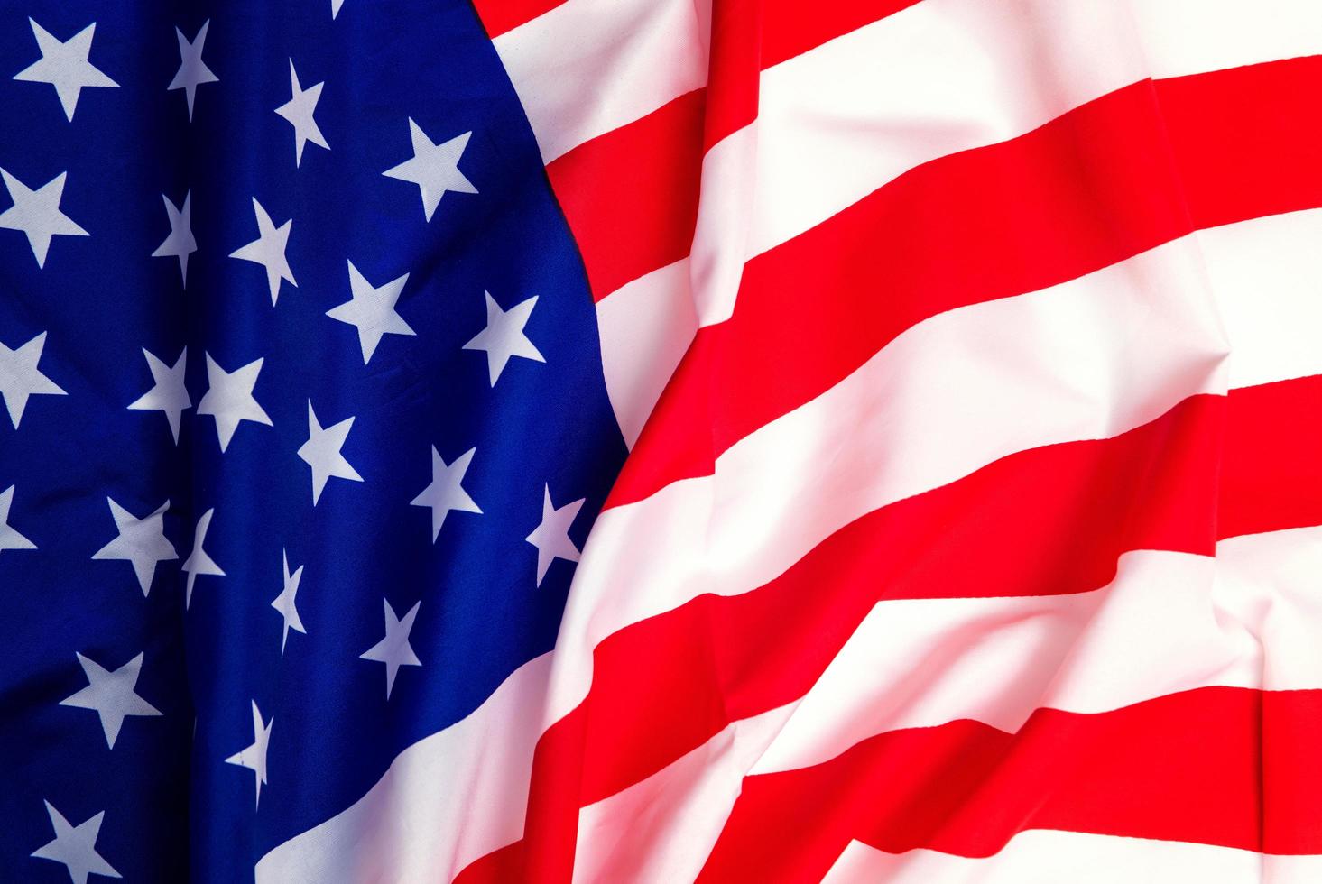 Happy Veterans Day concept. American flags against a blackboard background. November 11. photo