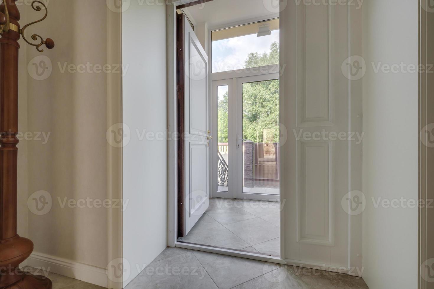 empty corridor in interior of entrance hall of modern apartments photo