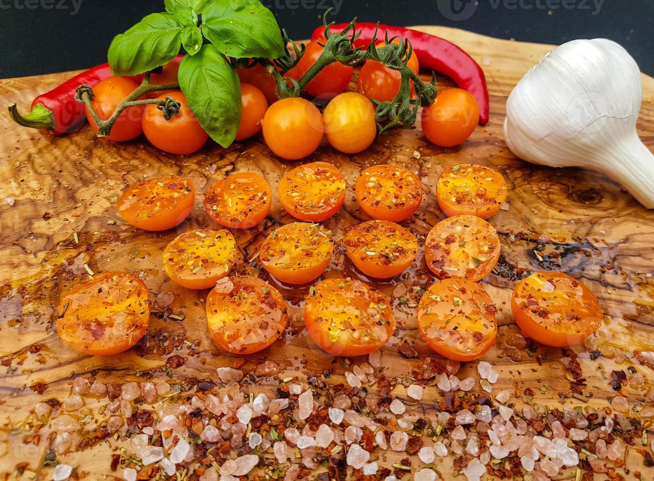 orange cocktail Tomatoes Solanum Lycopersicum with olive oil herbs and spices photo