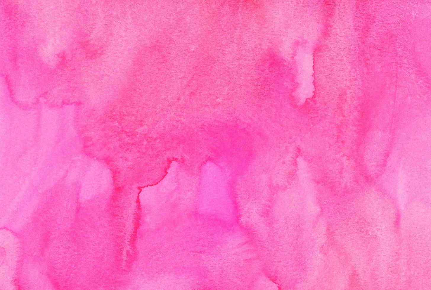 Watercolor pink background hand painted. Aquarelle bright pink stains on paper. photo