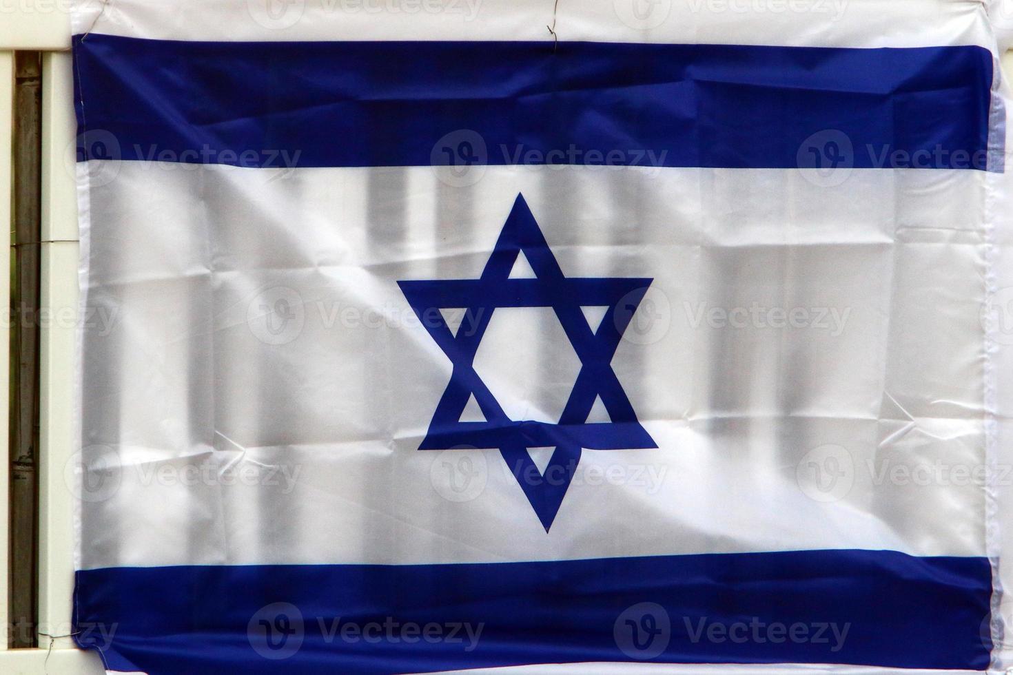 The blue and white flag of Israel with the six-pointed Star of David. photo