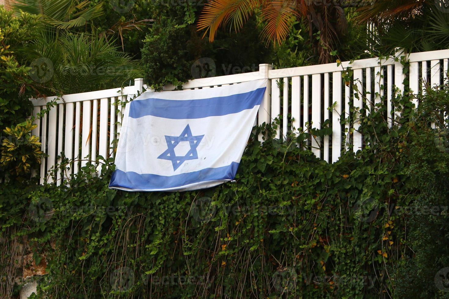 The blue and white flag of Israel with the six-pointed Star of David. photo