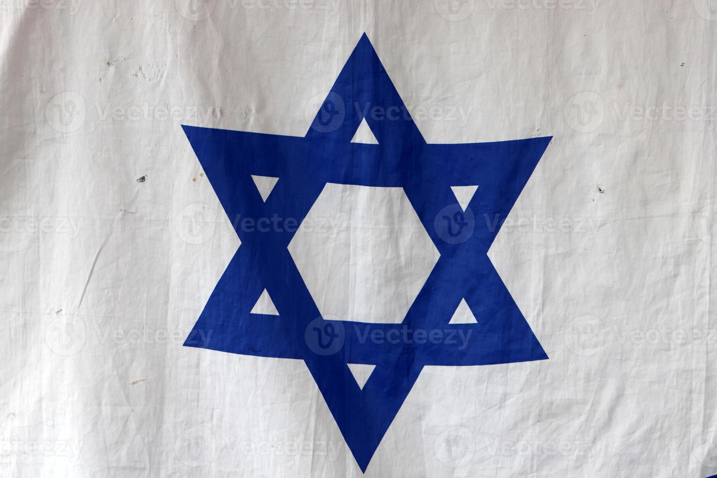 The blue and white flag of Israel with the six-pointed Star of David. photo