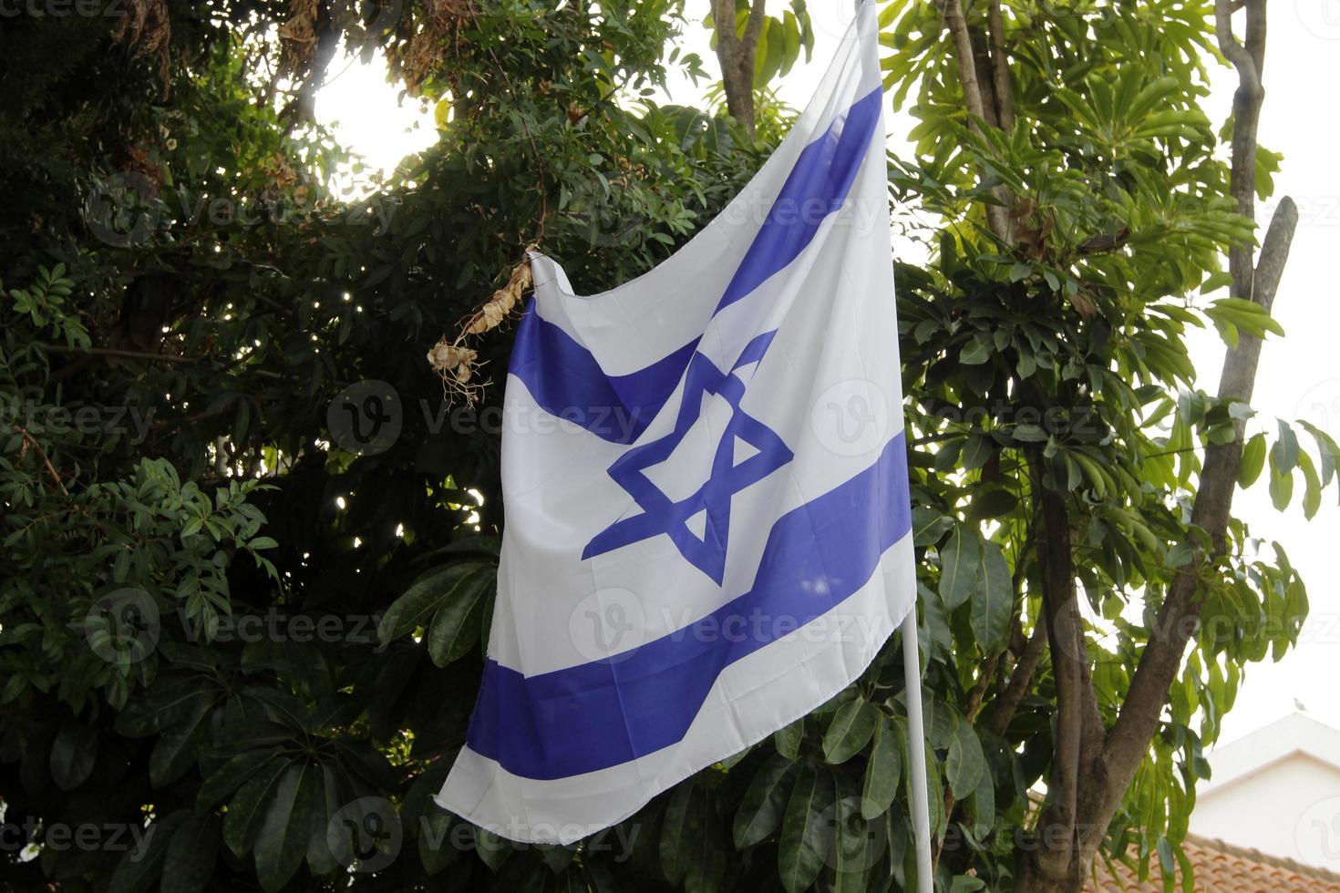 The blue and white flag of Israel with the six-pointed Star of David. photo