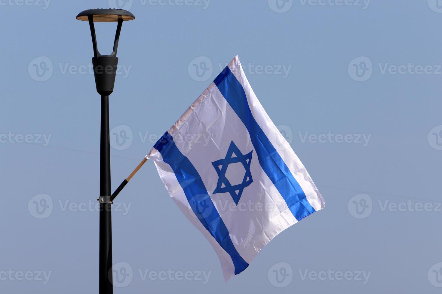 The blue and white flag of Israel with the six-pointed Star of David. photo