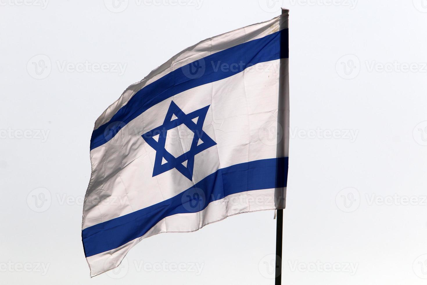 The blue and white flag of Israel with the six-pointed Star of David. photo