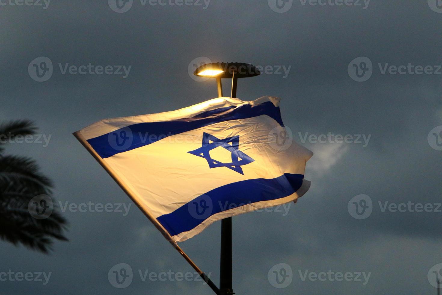 The blue and white flag of Israel with the six-pointed Star of David. photo