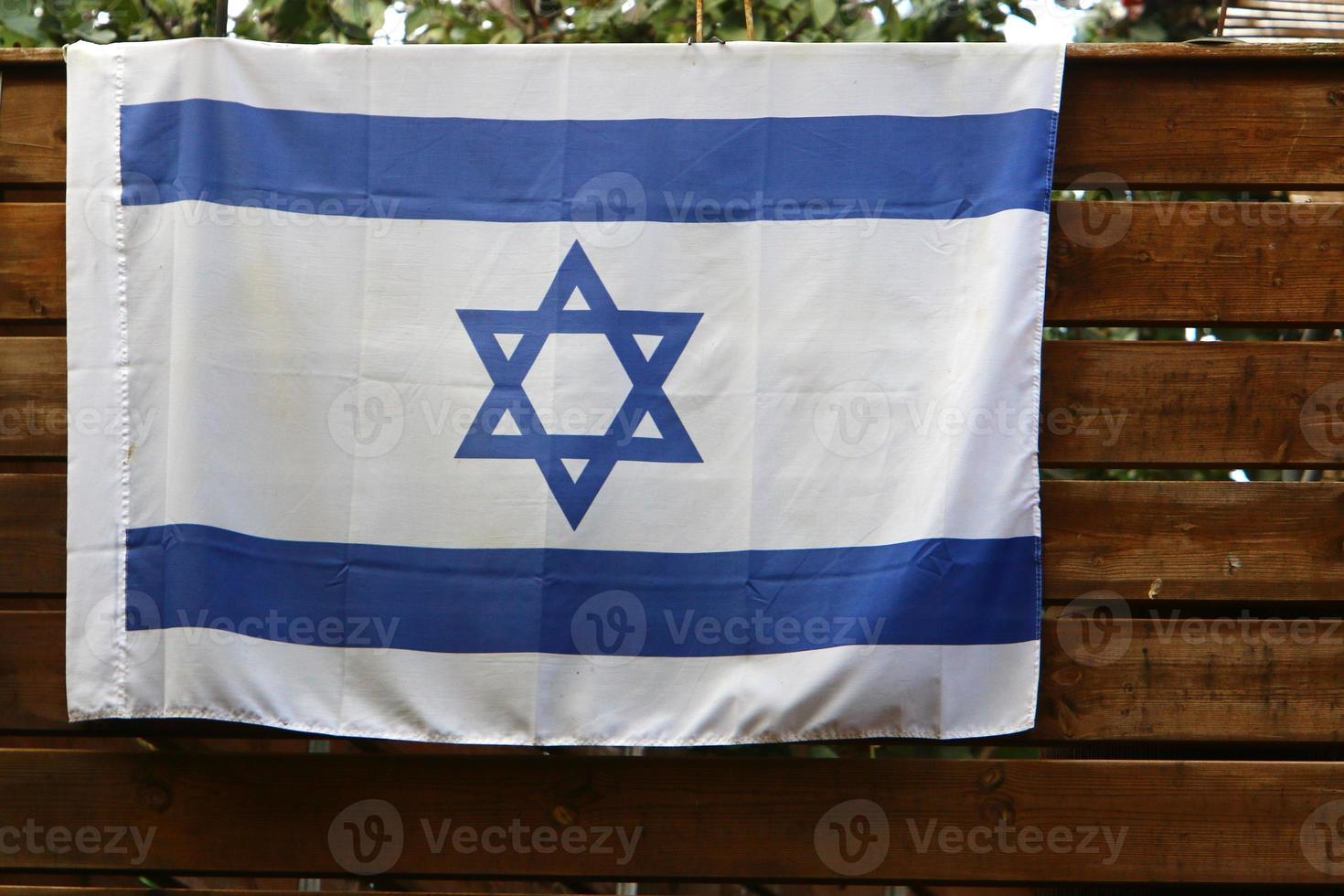 The blue and white flag of Israel with the six-pointed Star of David. photo