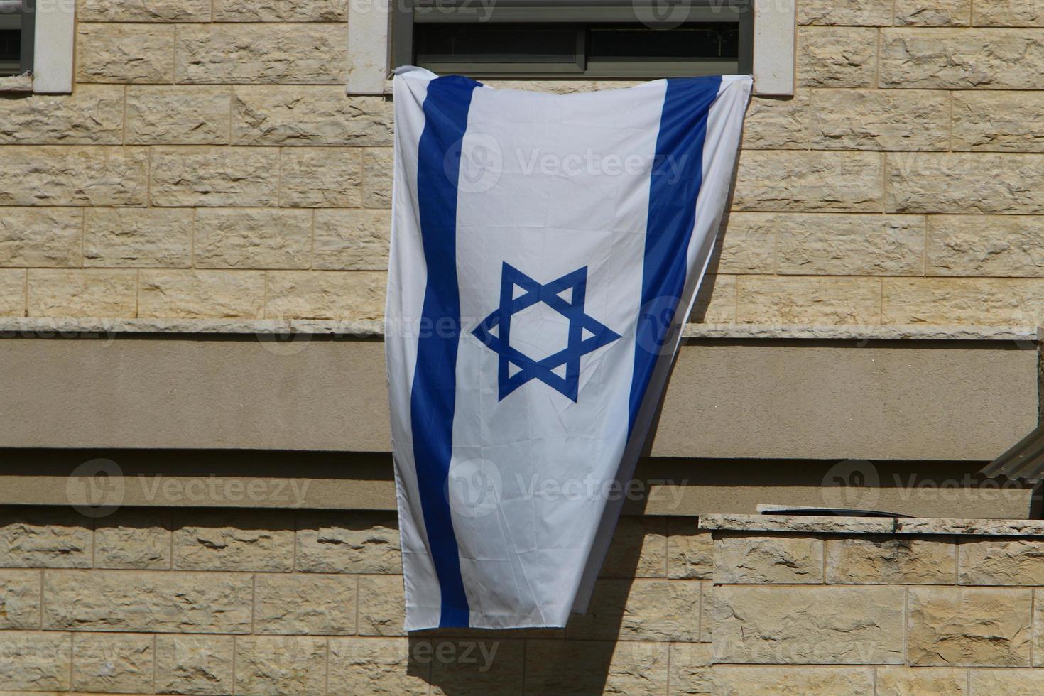 The blue and white flag of Israel with the six-pointed Star of David. photo