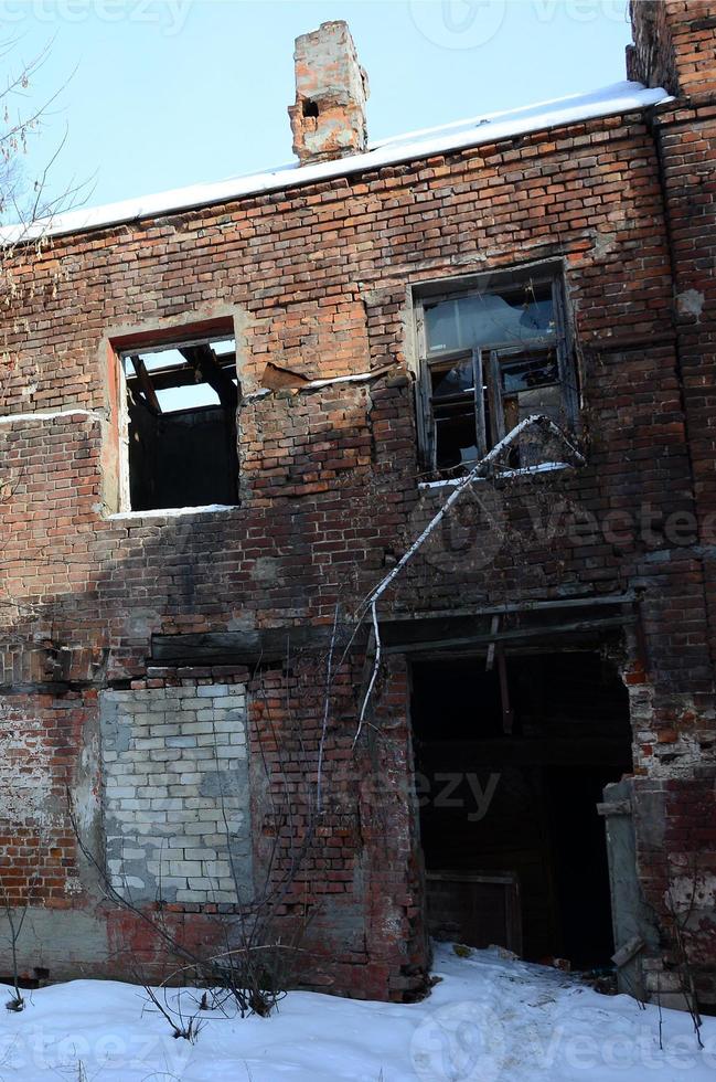 Fragment of an abandoned two-story building after military operations in Donetsk photo