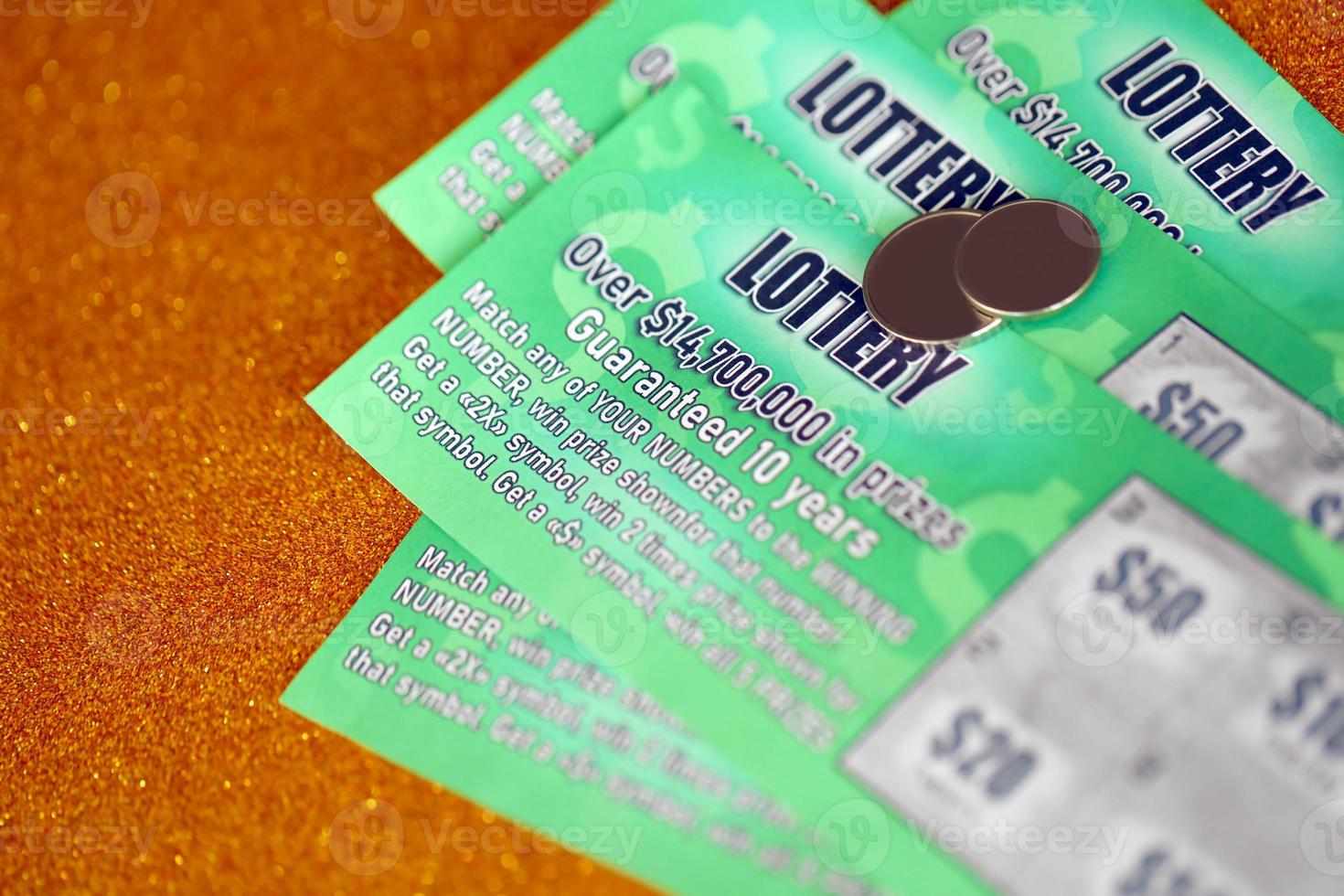 Close up view of green lottery scratch cards. Many used fake instant lottery tickets with gambling results. Gambling addiction photo