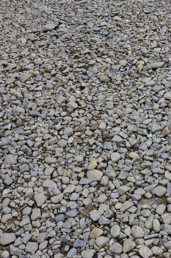 Texture of many crushed stones. Crushed stone is a solid base material for foundation photo
