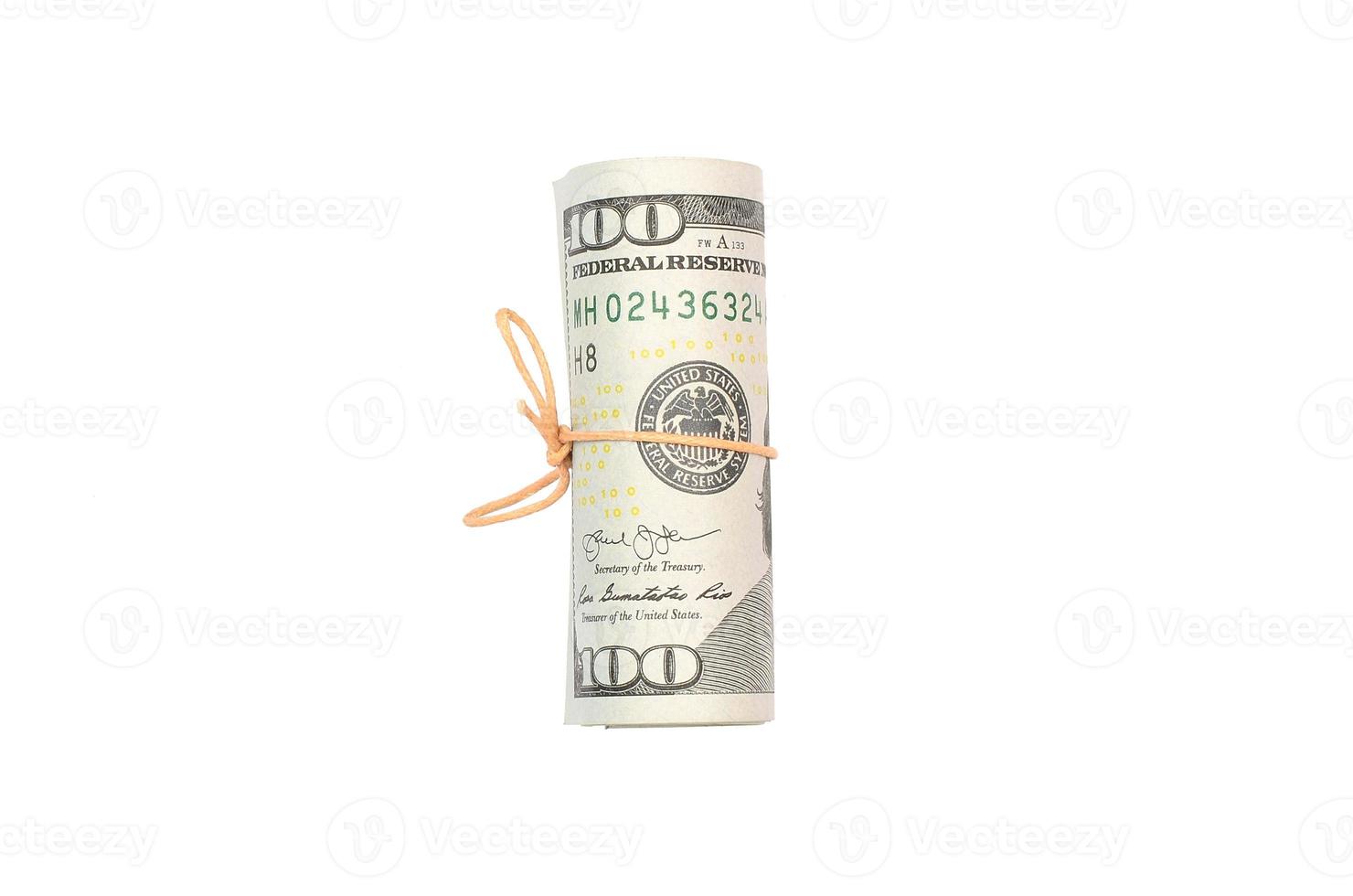 US dollars rolled up and tightened with band isolated on white background photo