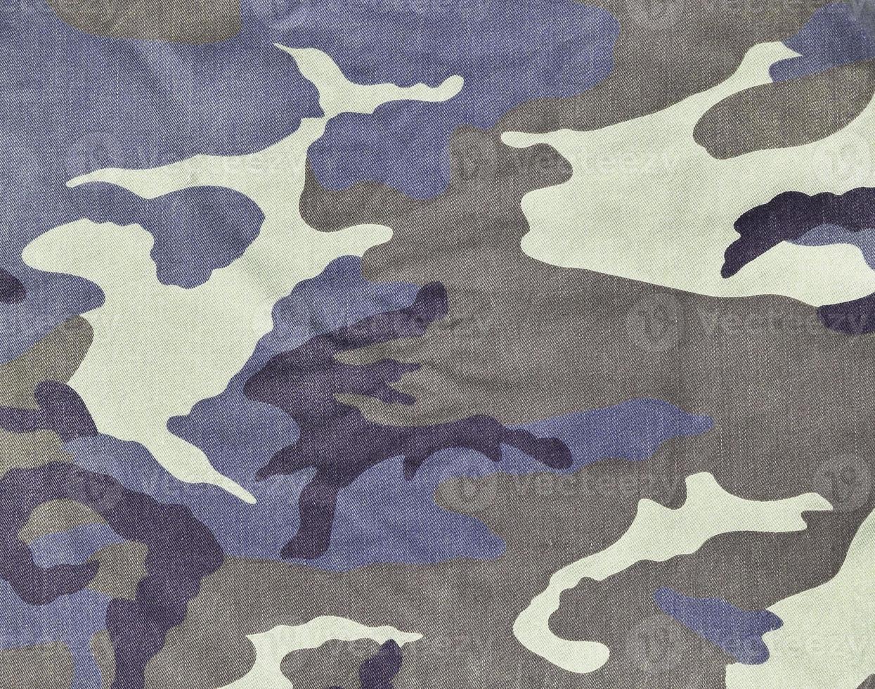 Texture of fabric with a camouflage painted in colors of the marsh. Army background image photo