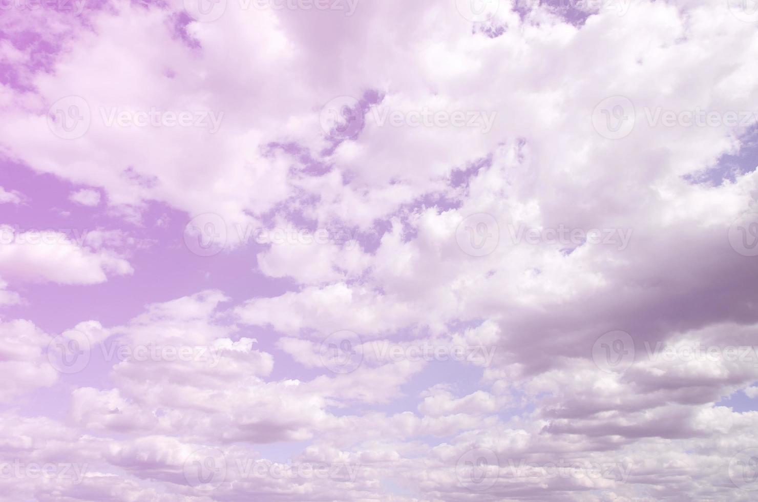 A blue sky with lots of white clouds of different sizes photo