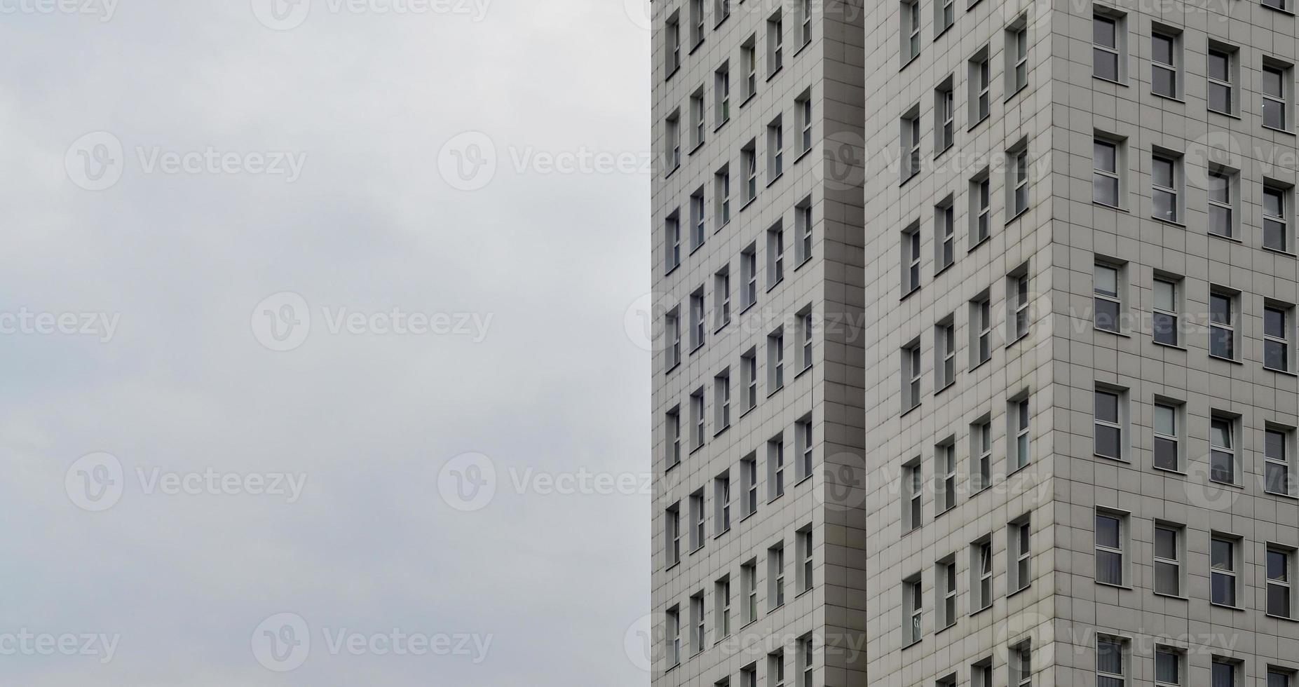 Multi-story office building with blue sky photo