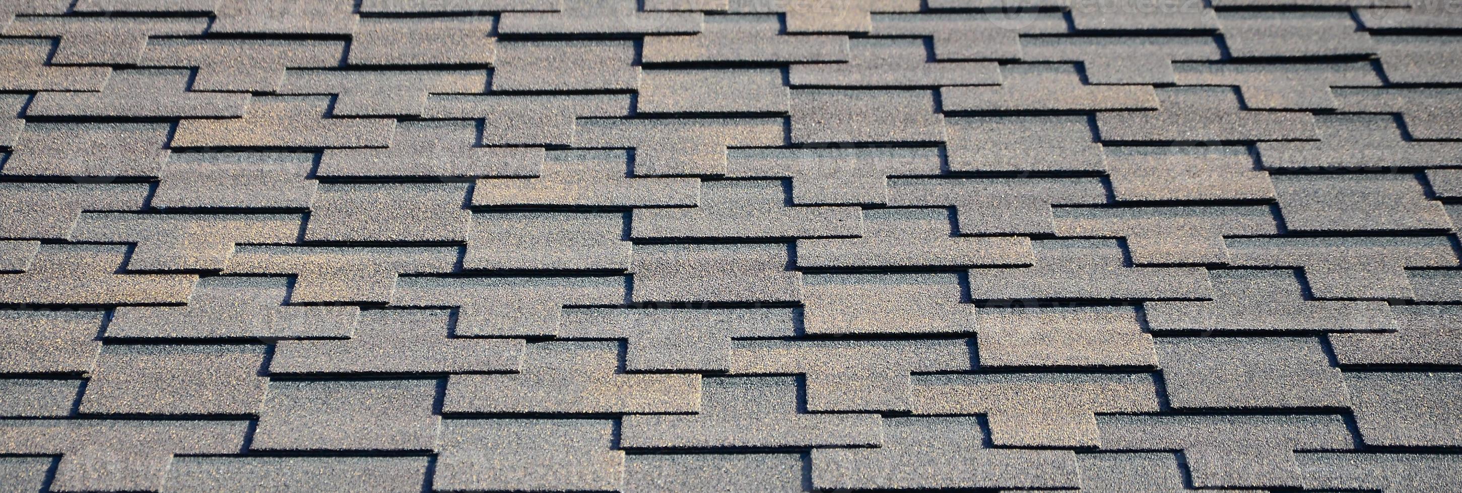 Modern roofing and decoration of chimneys. Flexible bitumen or slate shingles photo