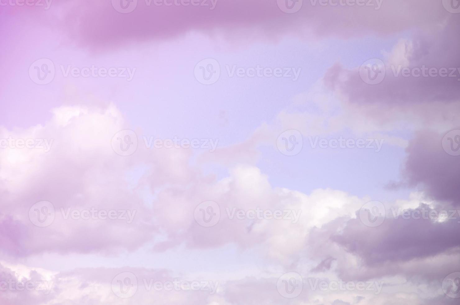 A blue sky with lots of white clouds of different sizes photo