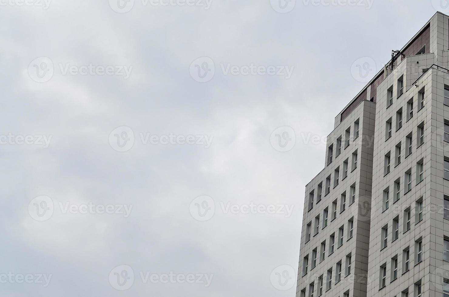 Multi-story office building with blue sky photo