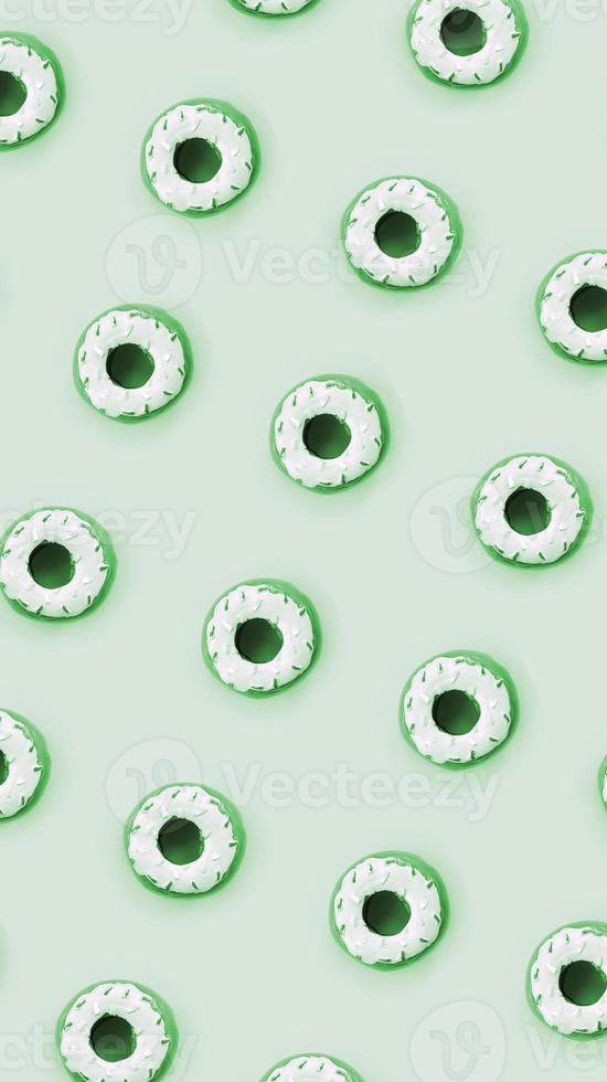 Many small plastic donuts lies on a pastel colorful background. Flat lay minimal pattern. Top view photo