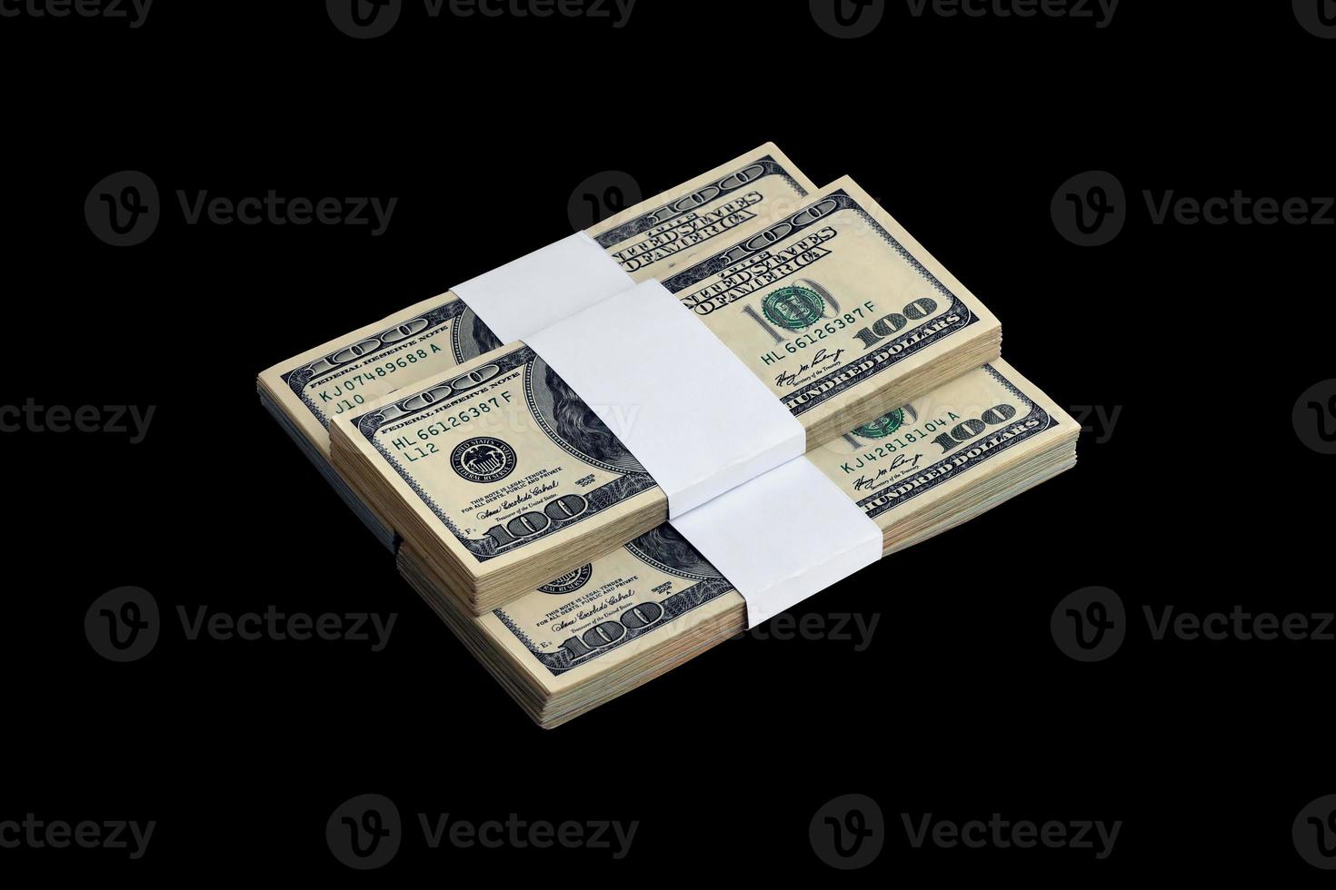 Bundle of US dollar bills isolated on black. Pack of american money with high resolution on perfect black background photo