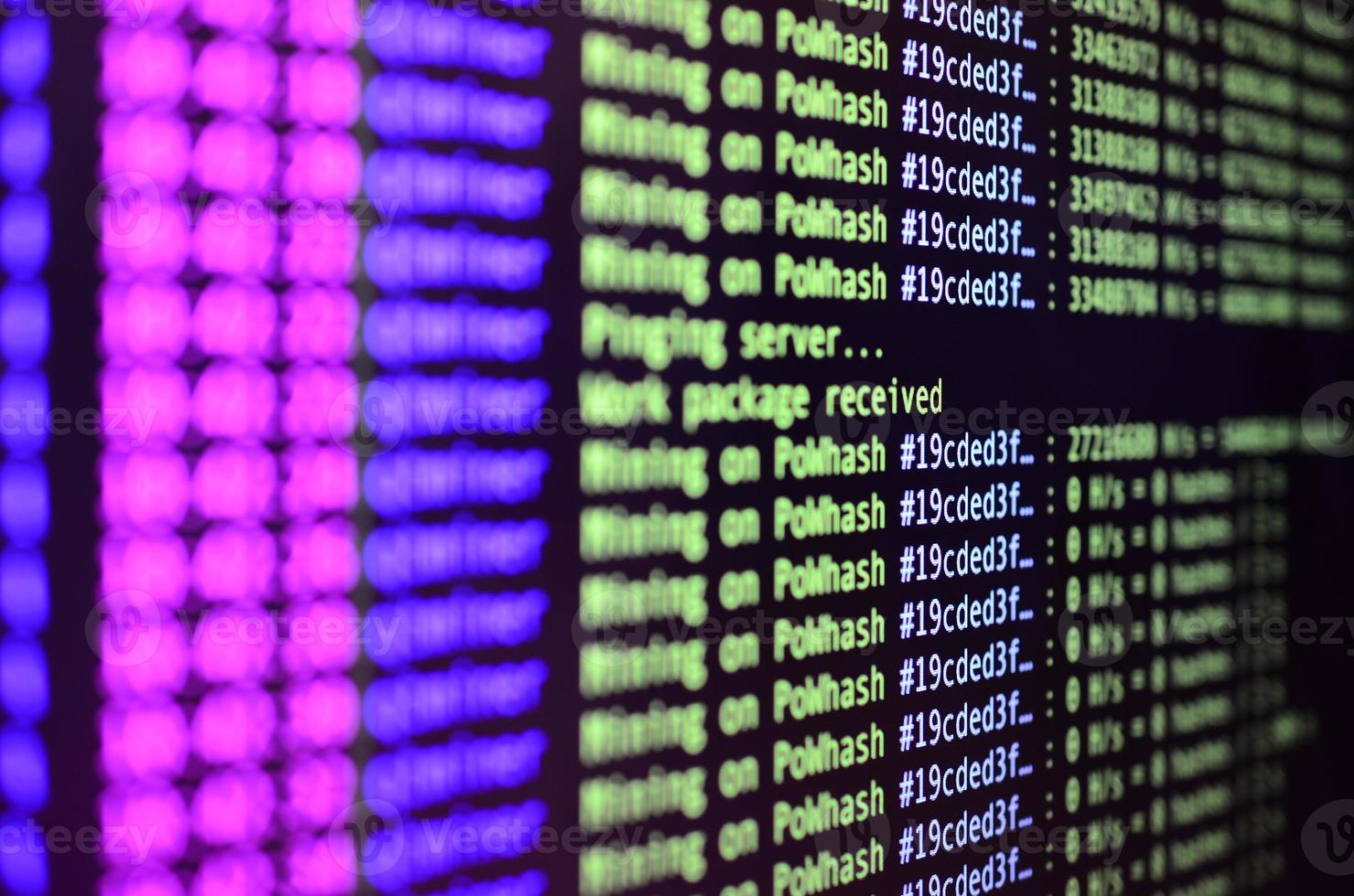 Macro snapshot of the program interface for crypto currency mining on the monitor of an office computer. The concept of mining bitcoins. The flow of information strings and data photo