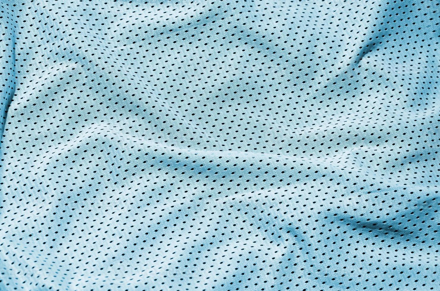 Sport clothing fabric texture background, top view of light blue cloth textile surface photo