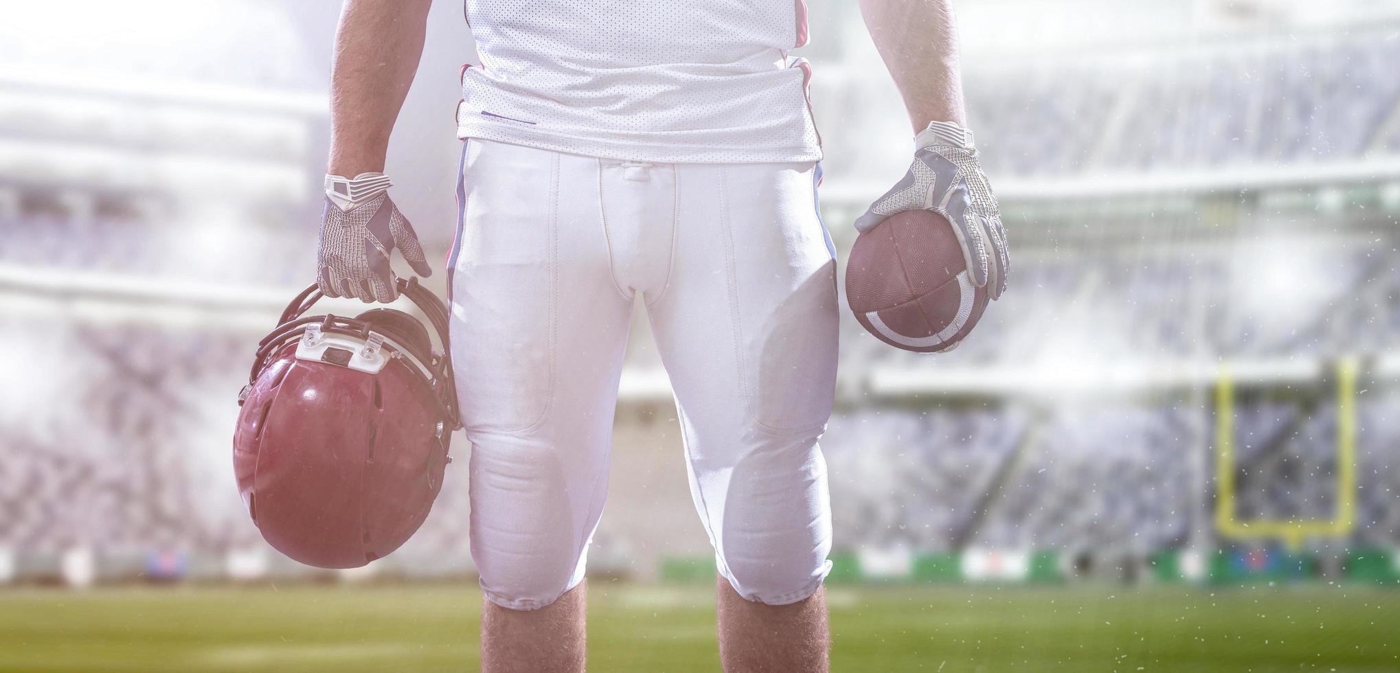 closeup American Football Player isolated on big modern stadium photo