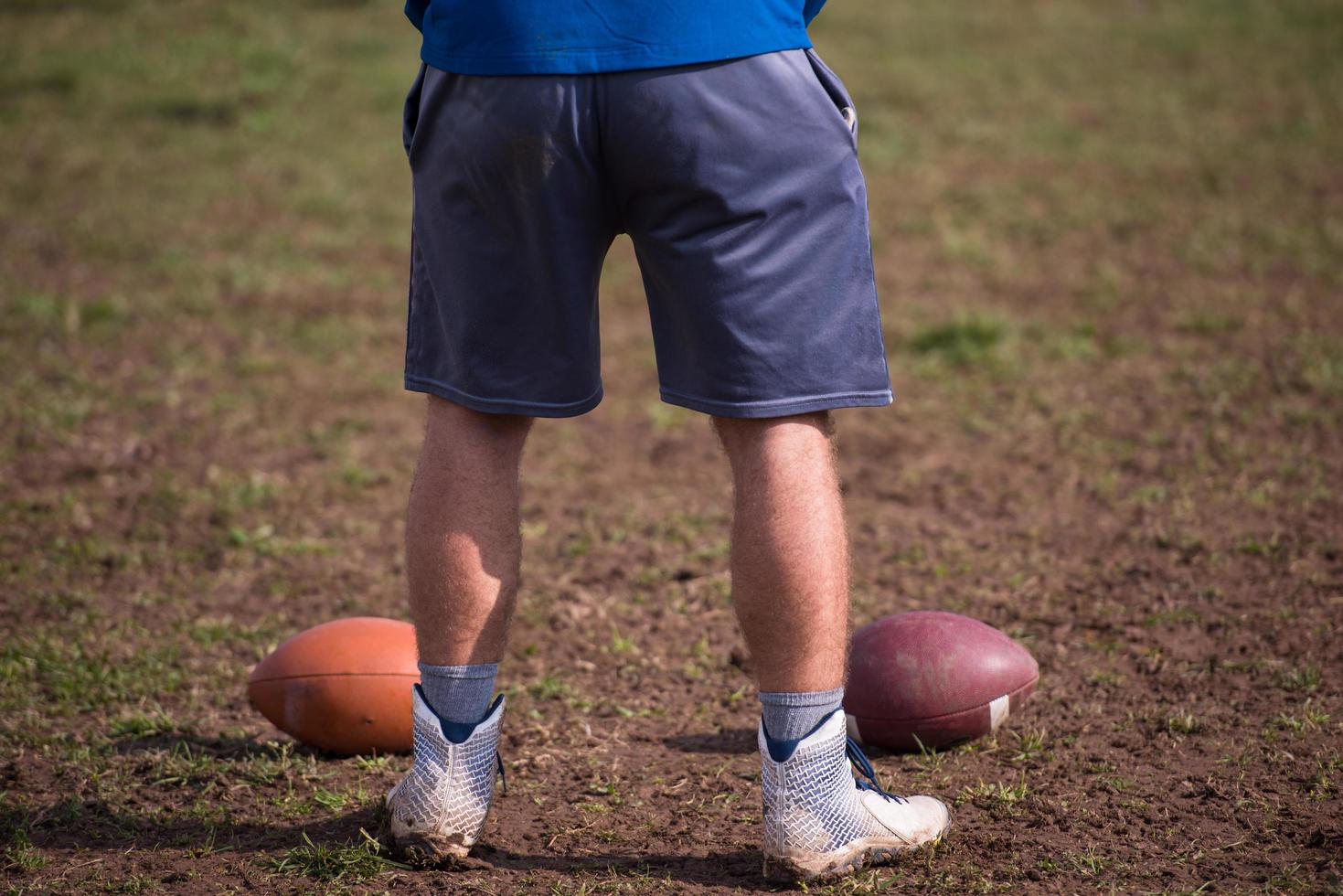 american football kicker practicing kickoff photo