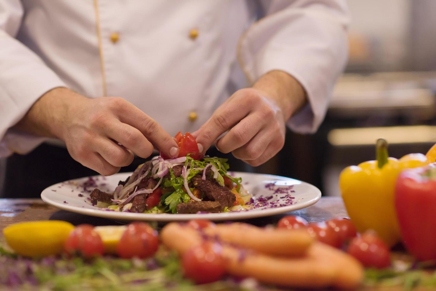 cook chef decorating garnishing prepared meal photo