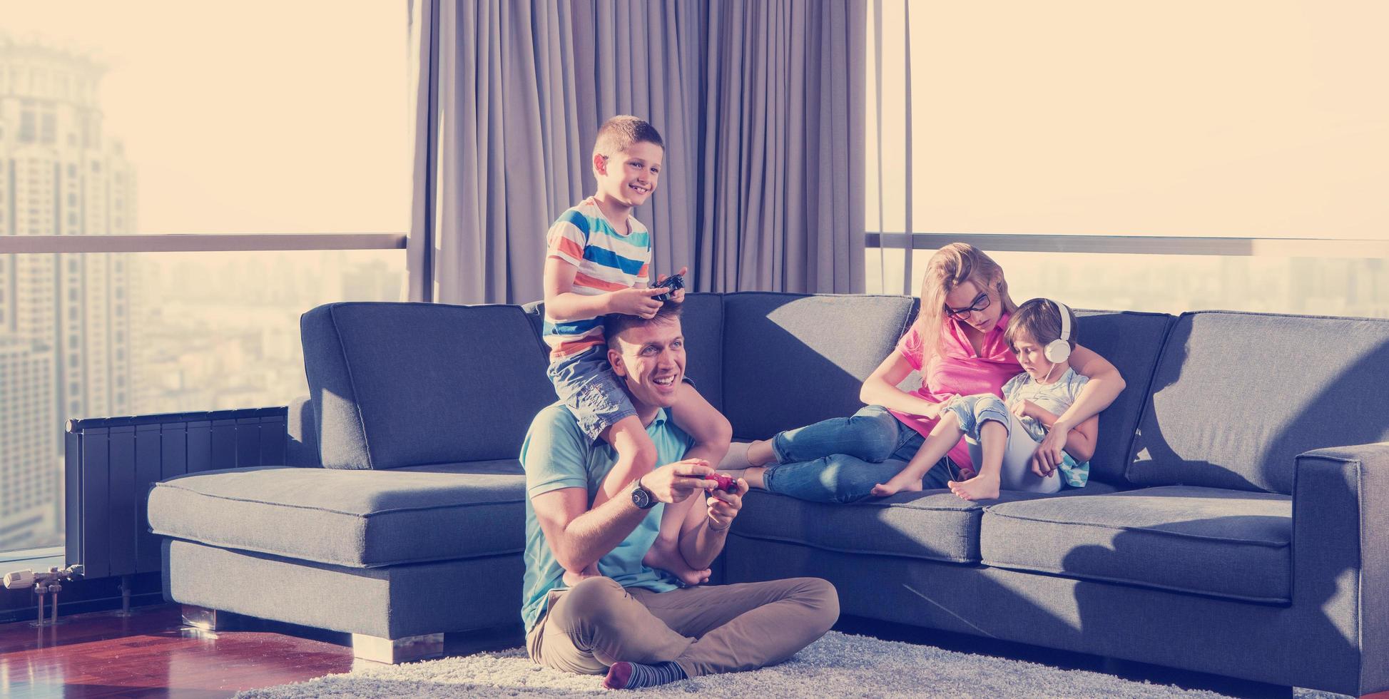 Happy family playing a video game photo