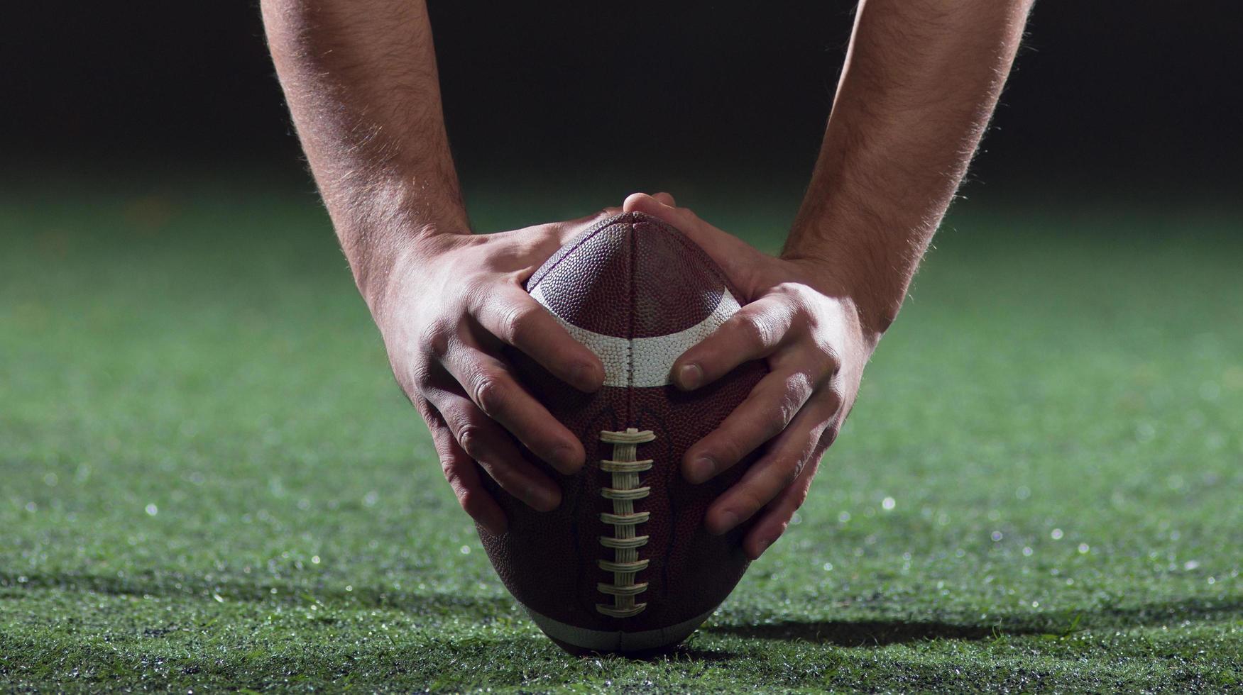 American football player starting football game photo