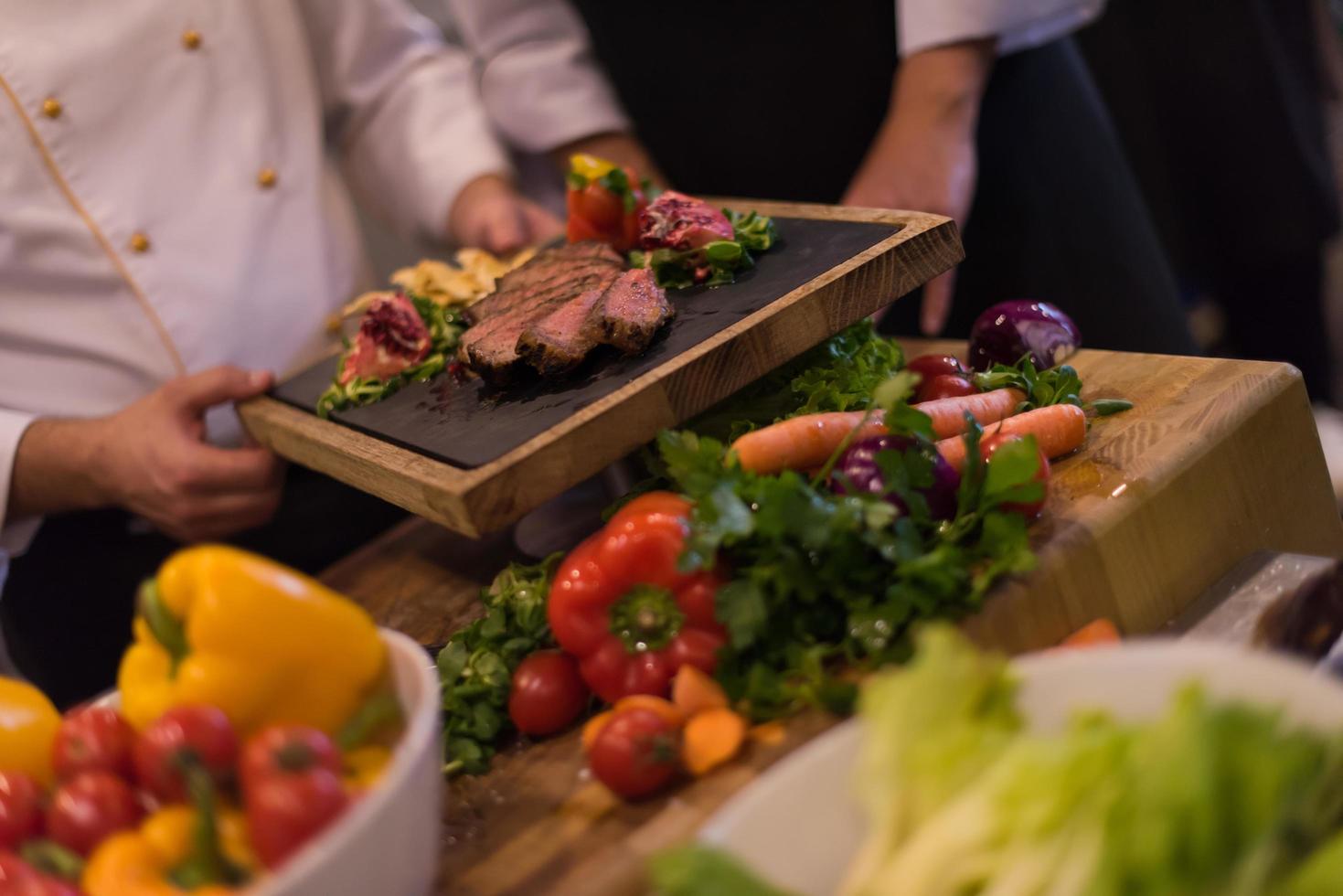 team cooks and chefs preparing meal photo