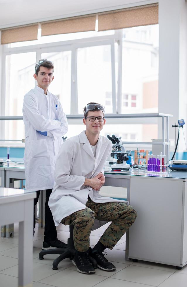 Group of young medical students doing research photo