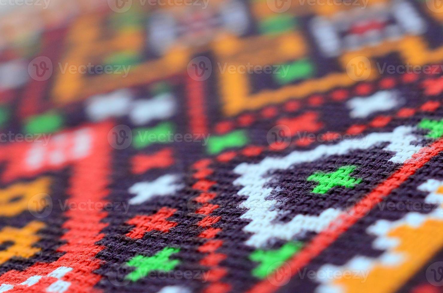 Traditional Ukrainian folk art knitted embroidery pattern on textile fabric photo