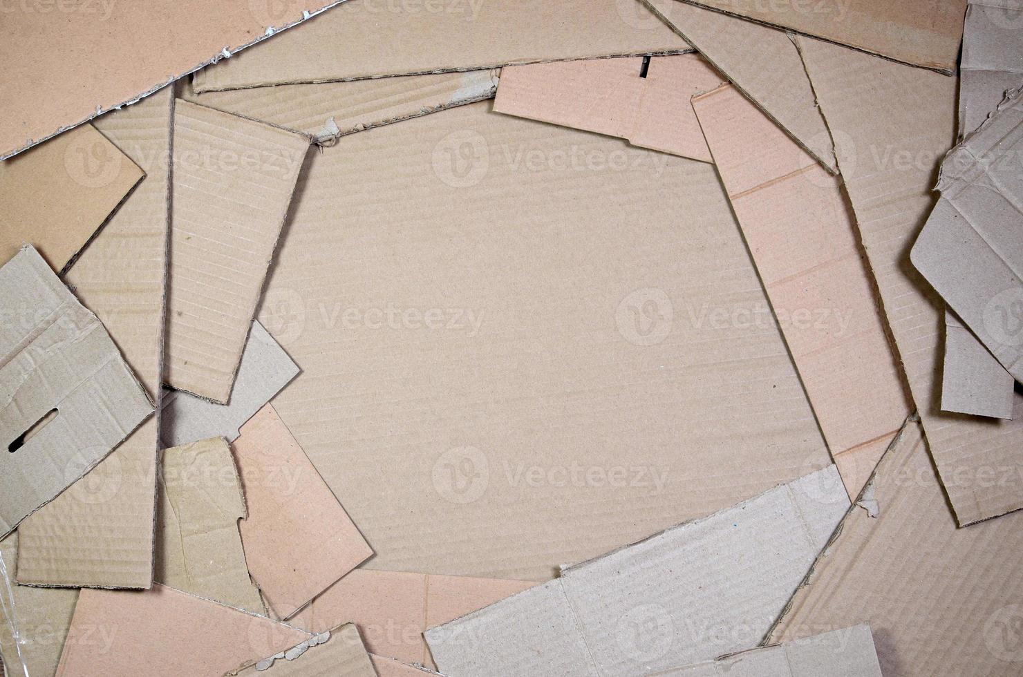 Background image with a lot of beige cardboard paper, which is used to make boxes for the transport of home appliances and postal parcels. Carton texture photo