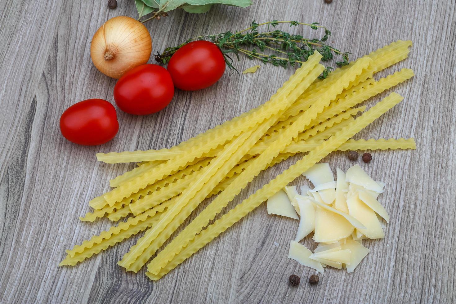 Mafalde pasta on wood 12770253 Stock Photo at Vecteezy