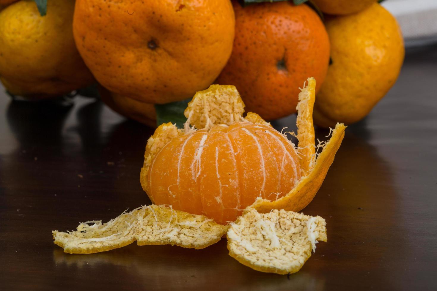 Tangerine on wood photo