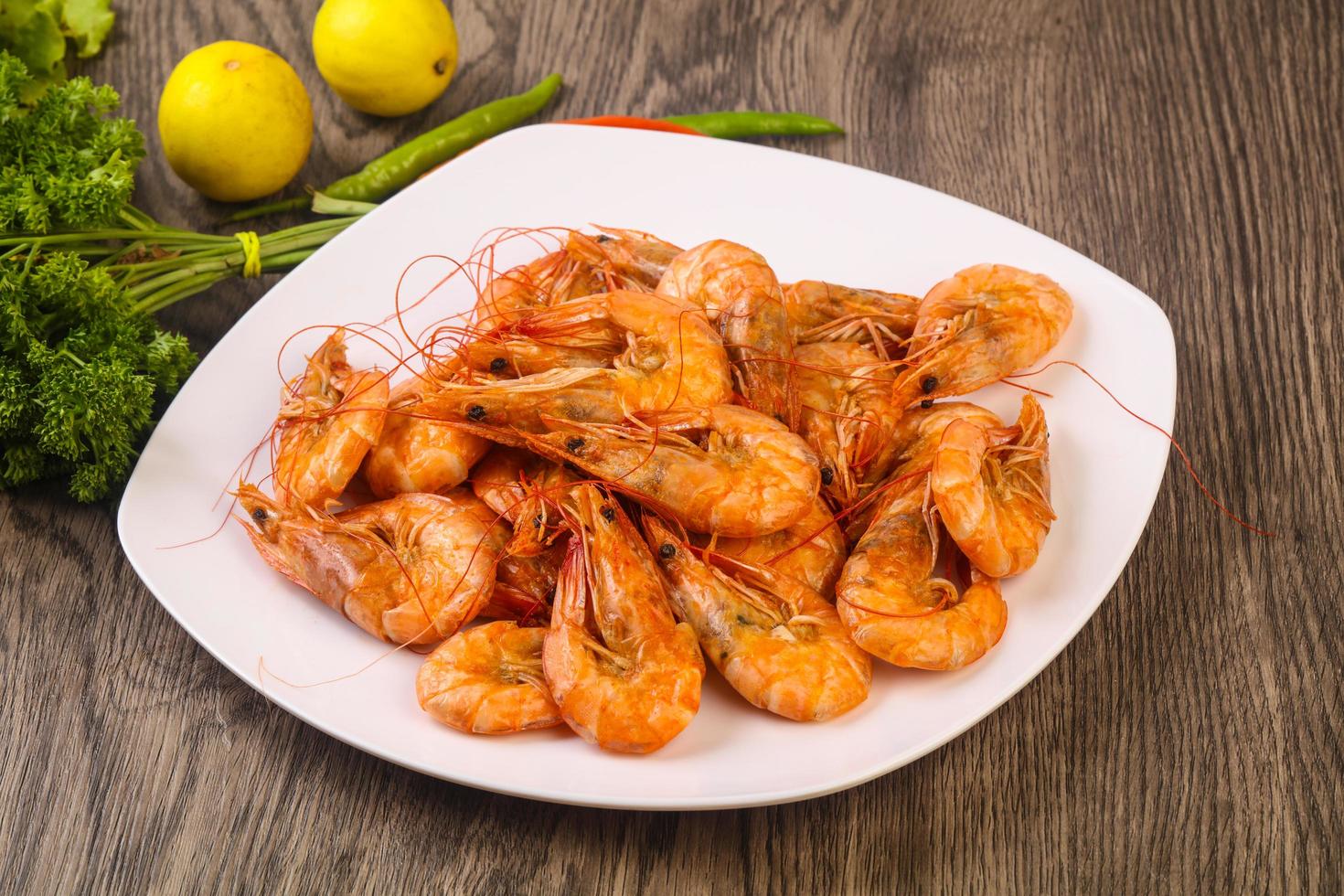 Boiled prawns on wood photo