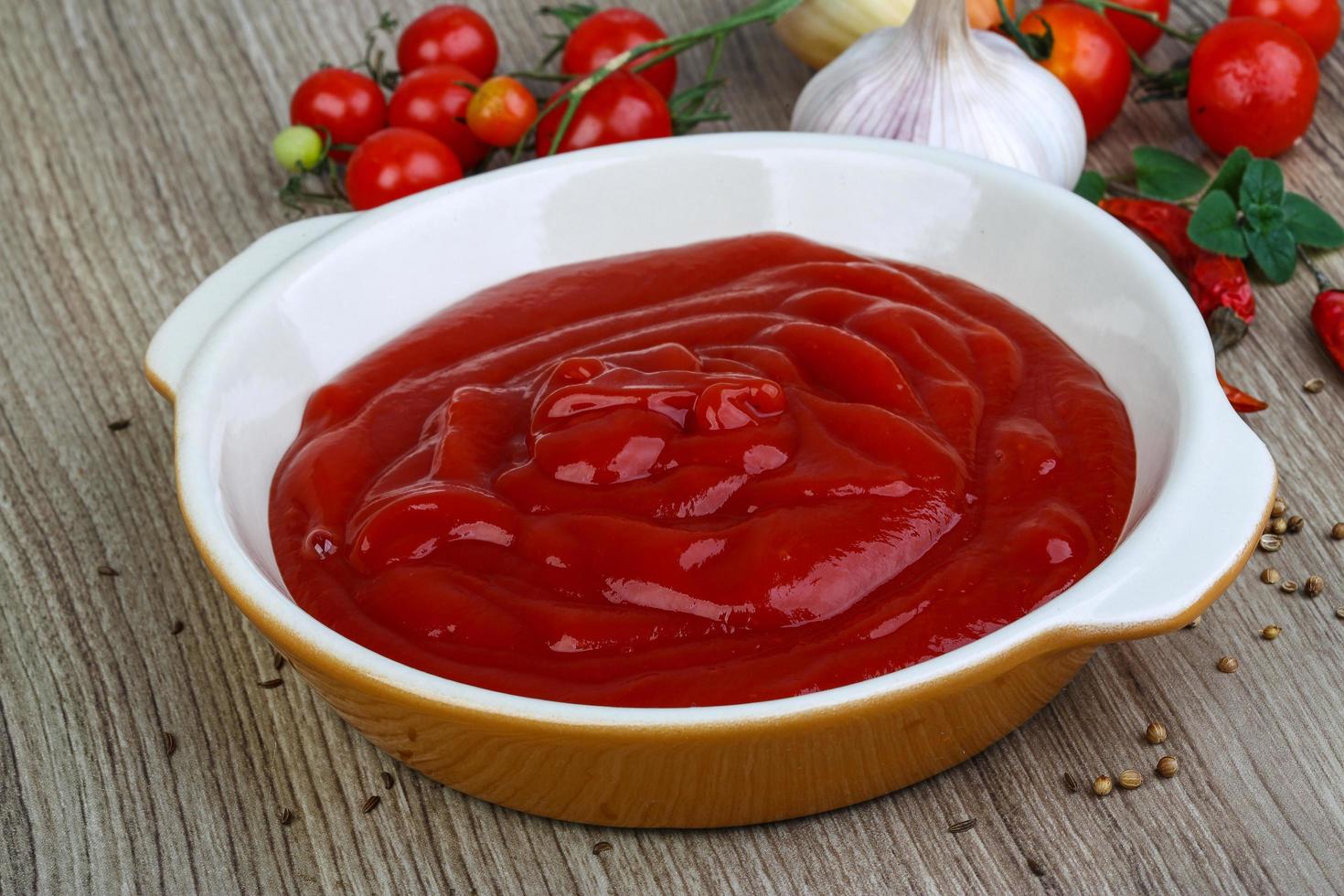 Tomato ketchup on wood photo