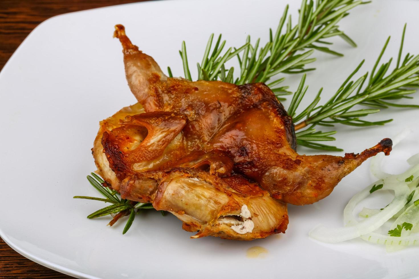 Grilled quail on wood photo