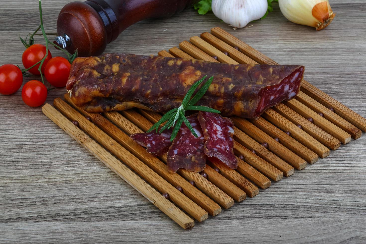 Salami sausage on wood photo